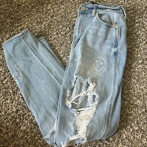 smiley face hollister ripped jeans.